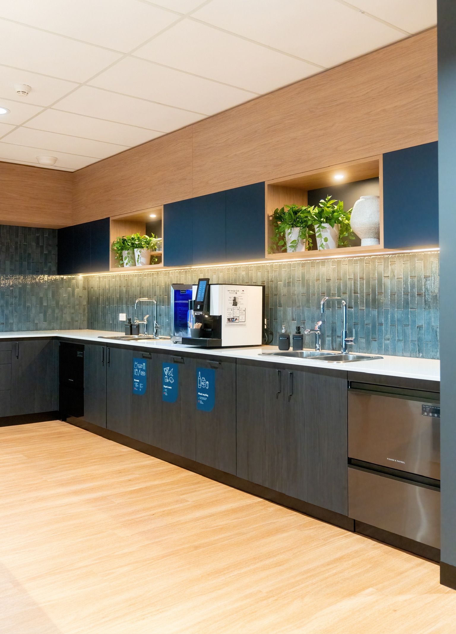 Modern Office Kitchenette With Dark Cabinets — PKJ Design in Unanderra, NSW