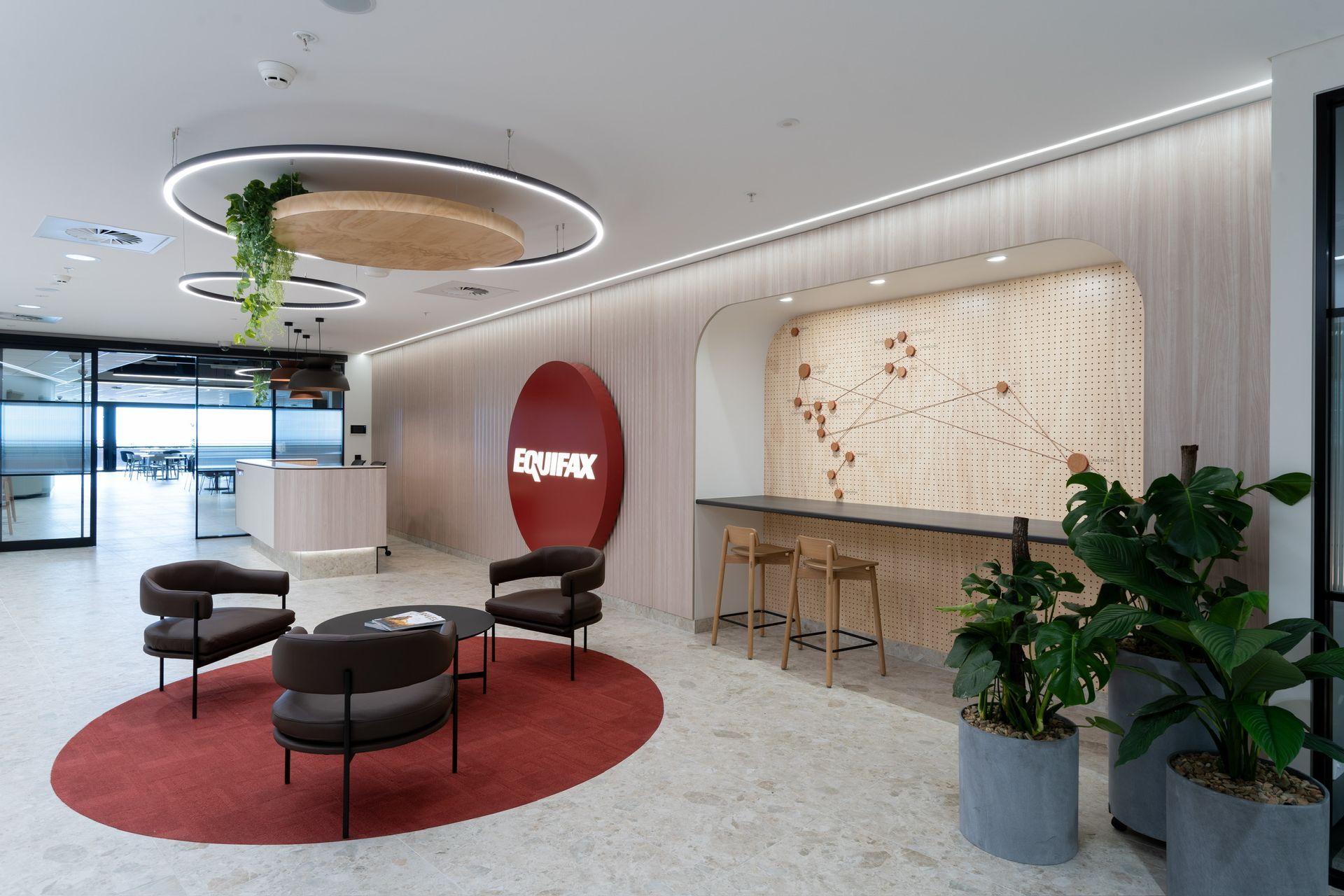 Modern Office Lobby With Red Circular Seating Area — PKJ Design in Unanderra, NSW
