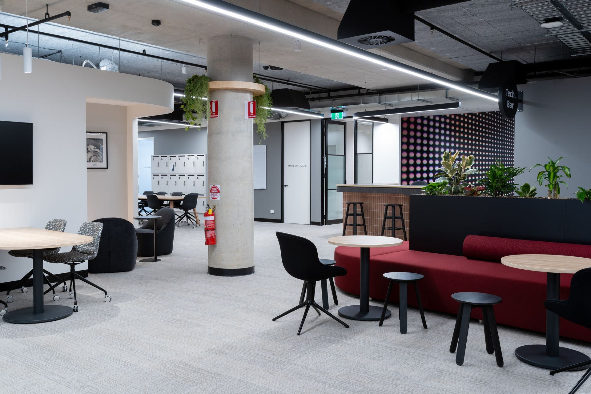 Modern Office Lounge With Red Booths — PKJ Design in Unanderra, NSW