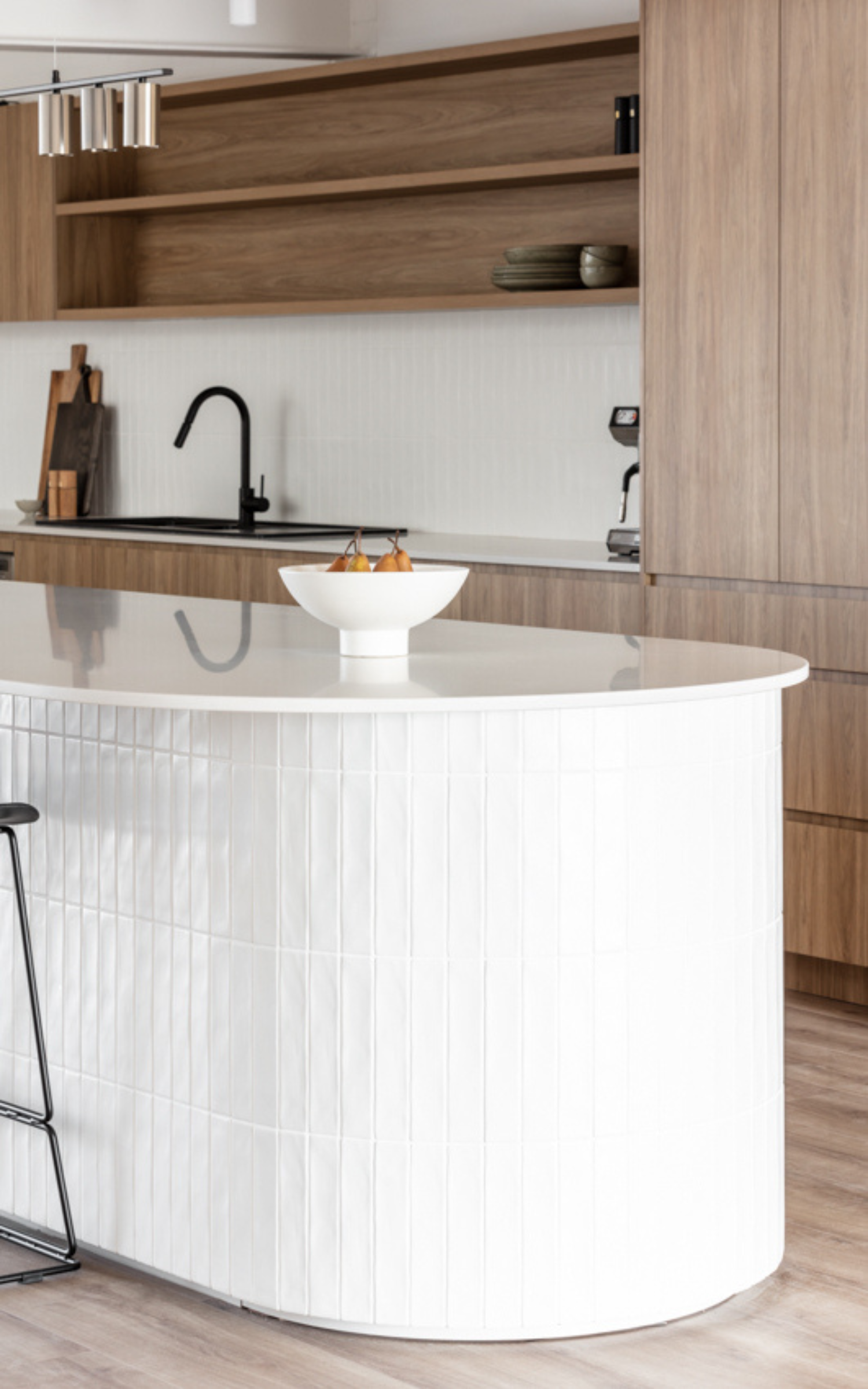 Modern Kitchen With White Curved Island — PKJ Design in Unanderra, NSW