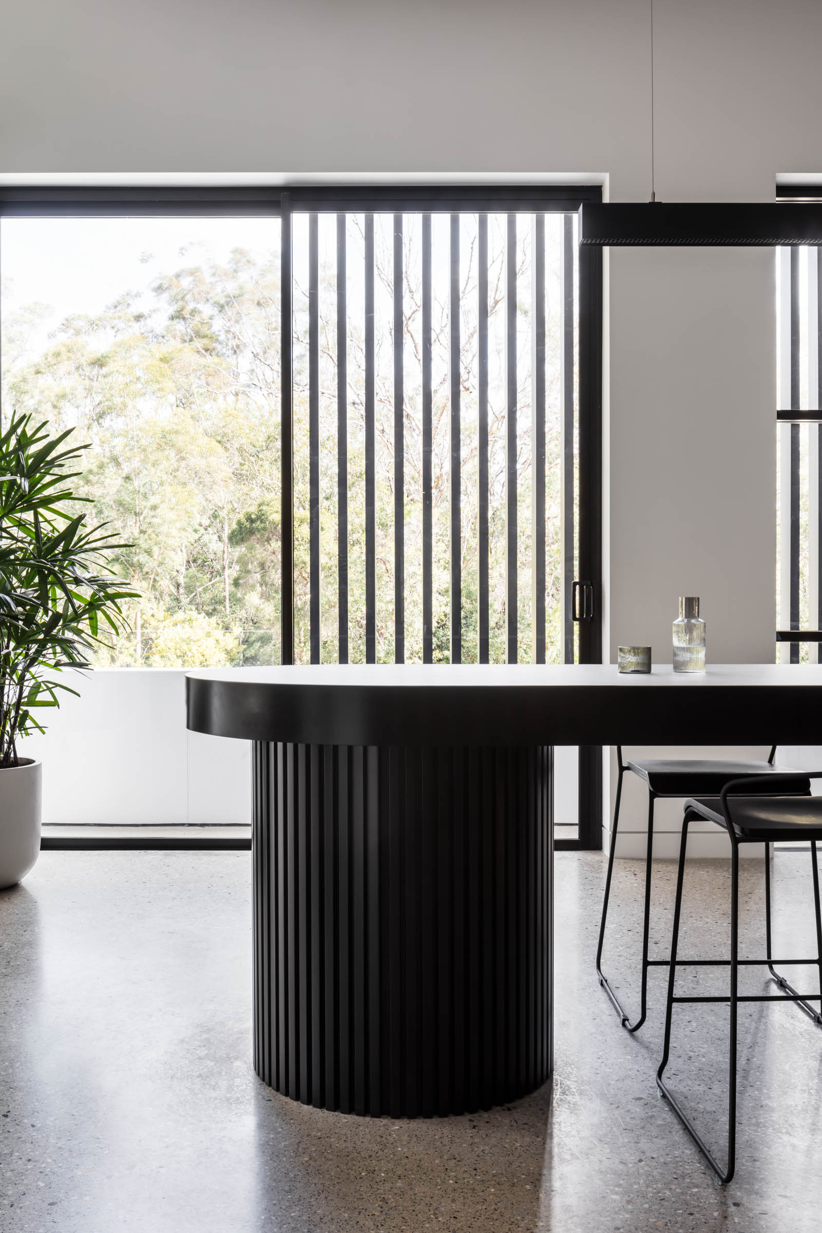 Modern Kitchen With Black Island, Bar Stools — PKJ Design in Unanderra, NSW