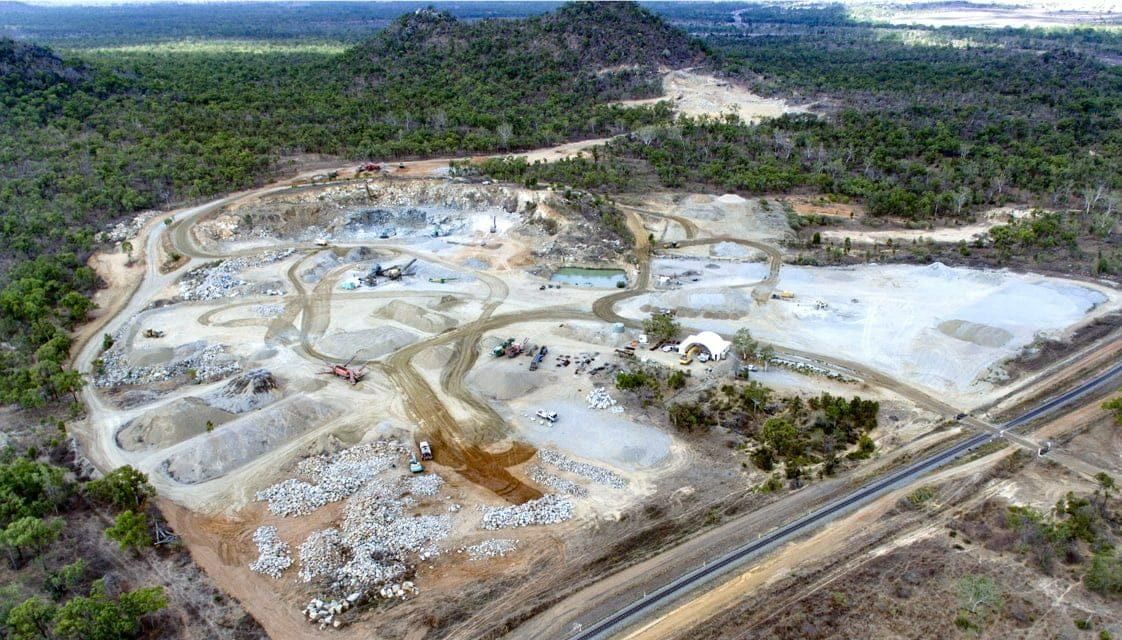 An Aerial View of A Large Rocky Area Surrounded by Trees and A Road — Hillery Group in Belmore, NSW