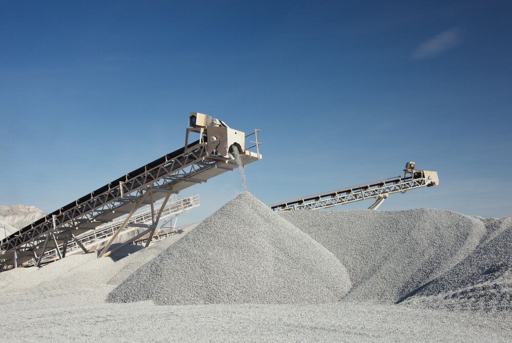Two Conveyor Belts Are Stacked on Top of a Pile of Gravel — Hillery Group in Umina, NSW