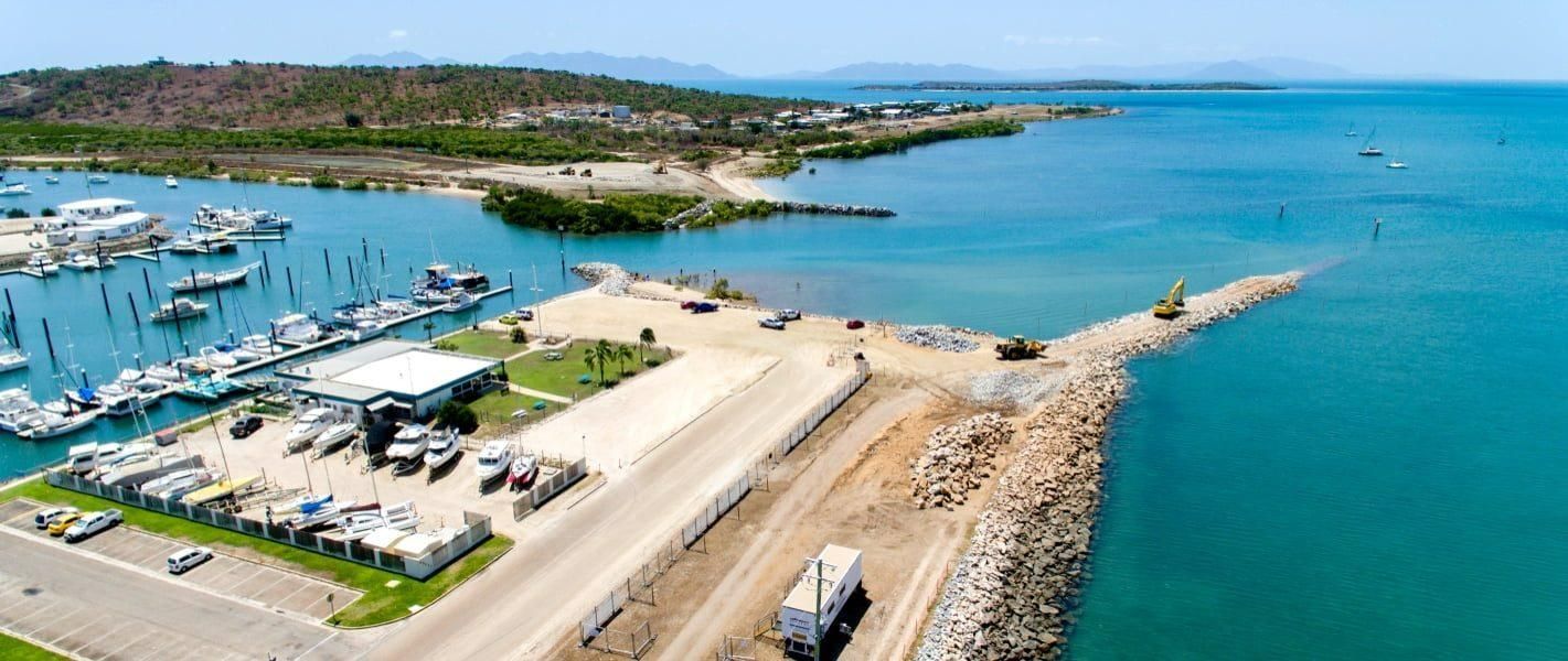 An Aerial View of A Marina with Boats Docked in The Water — Hillery Group in Belmore, NSW