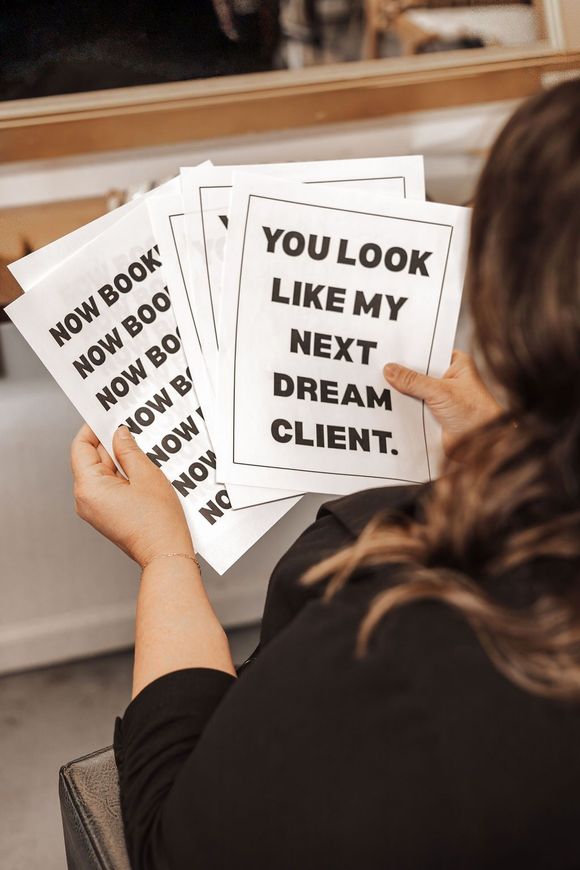 Woman holding signs that say