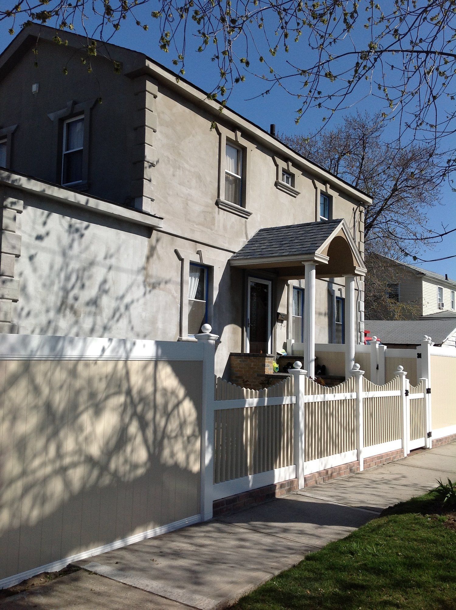 A house with a white picket fence around it