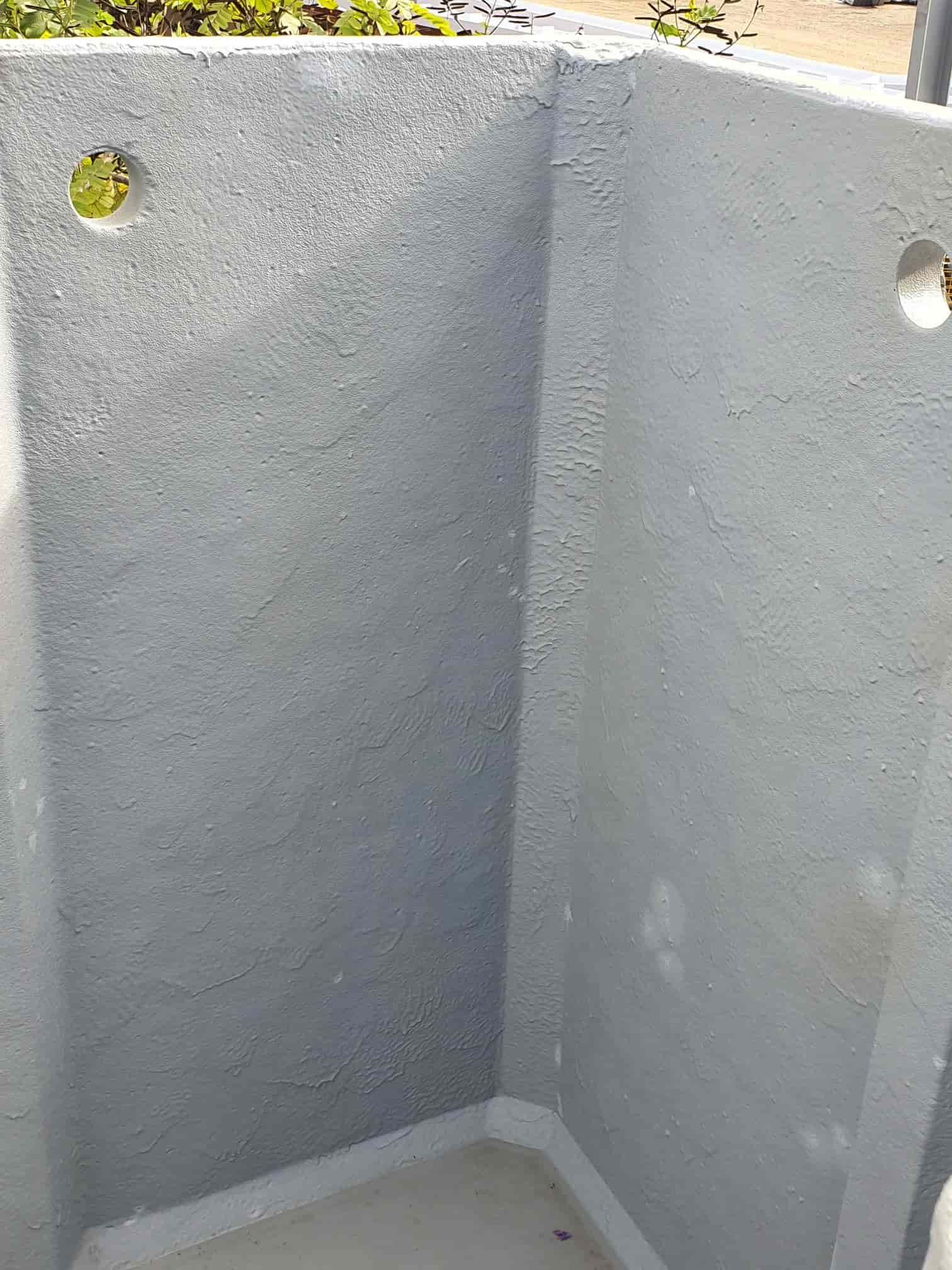 A Corner of a Concrete Wall With Holes in It  — Waters Abrasive Blasting Services In Darwin, NT