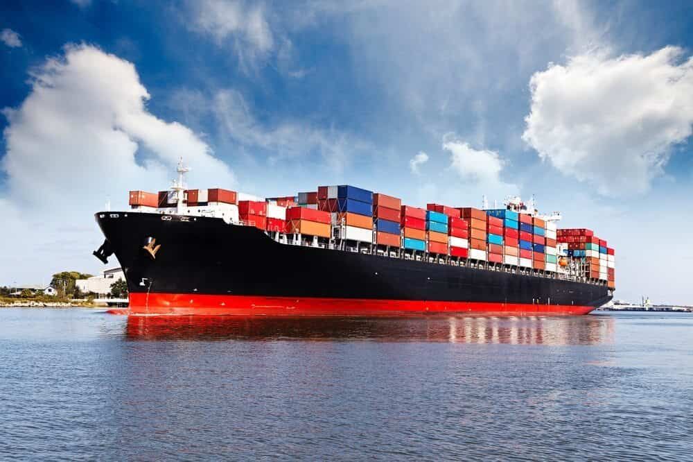 A Large Container Ship is Floating on Top of a Body of Water — Waters Abrasive Blasting Services In Shaw, QLD