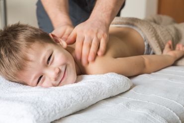 A boy getting a back adjustment