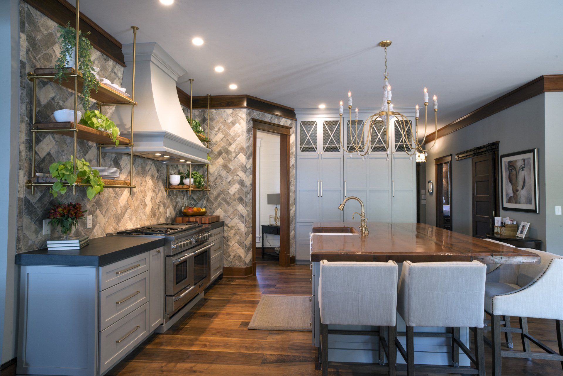 A kitchen with stainless steel appliances and a large island.