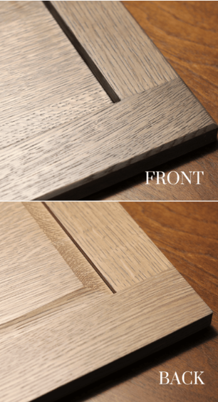 Close-up of wood flooring sample showing front and back finishes in different tones