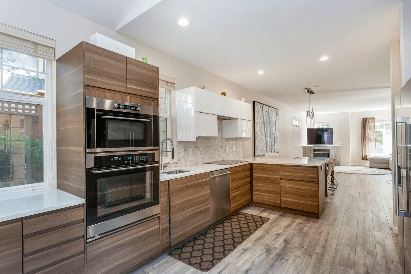 A kitchen with wooden cabinets and stainless steel appliances.