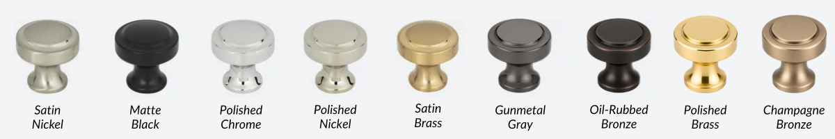 Row of small decorative knob pulls in silver, black, white, beige, gold, and bronze finishes.
