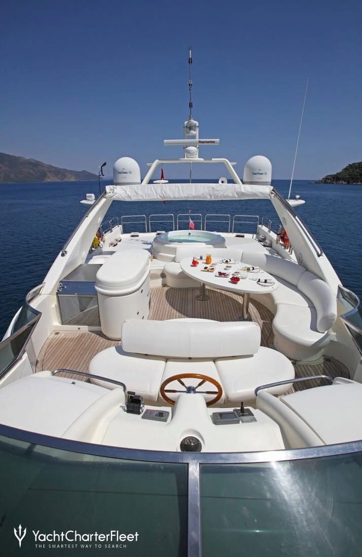 Luxury Yacht Deck on Calm Blue Water, With White Seating — Baran Yachting in Maroochydore, QLD