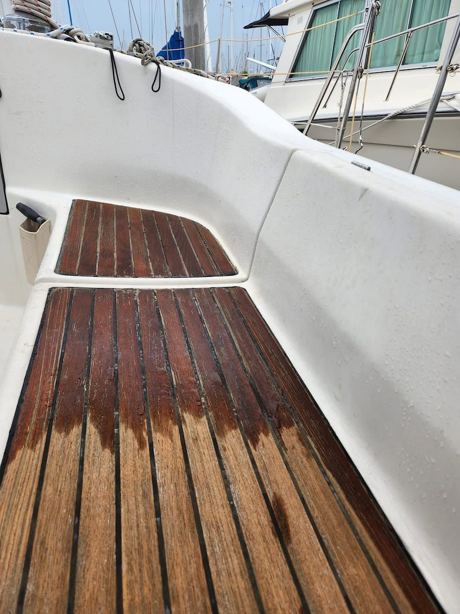 Wooden Boat Deck With White Fiberglass Sides and Ladder — Baran Yachting in Maroochydore, QLD