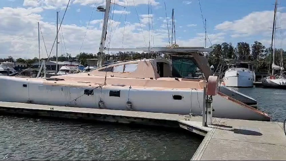 Large Beige Yacht Docked at a Marina Beside a Concrete Pier — Baran Yachting in Buderim, QLD