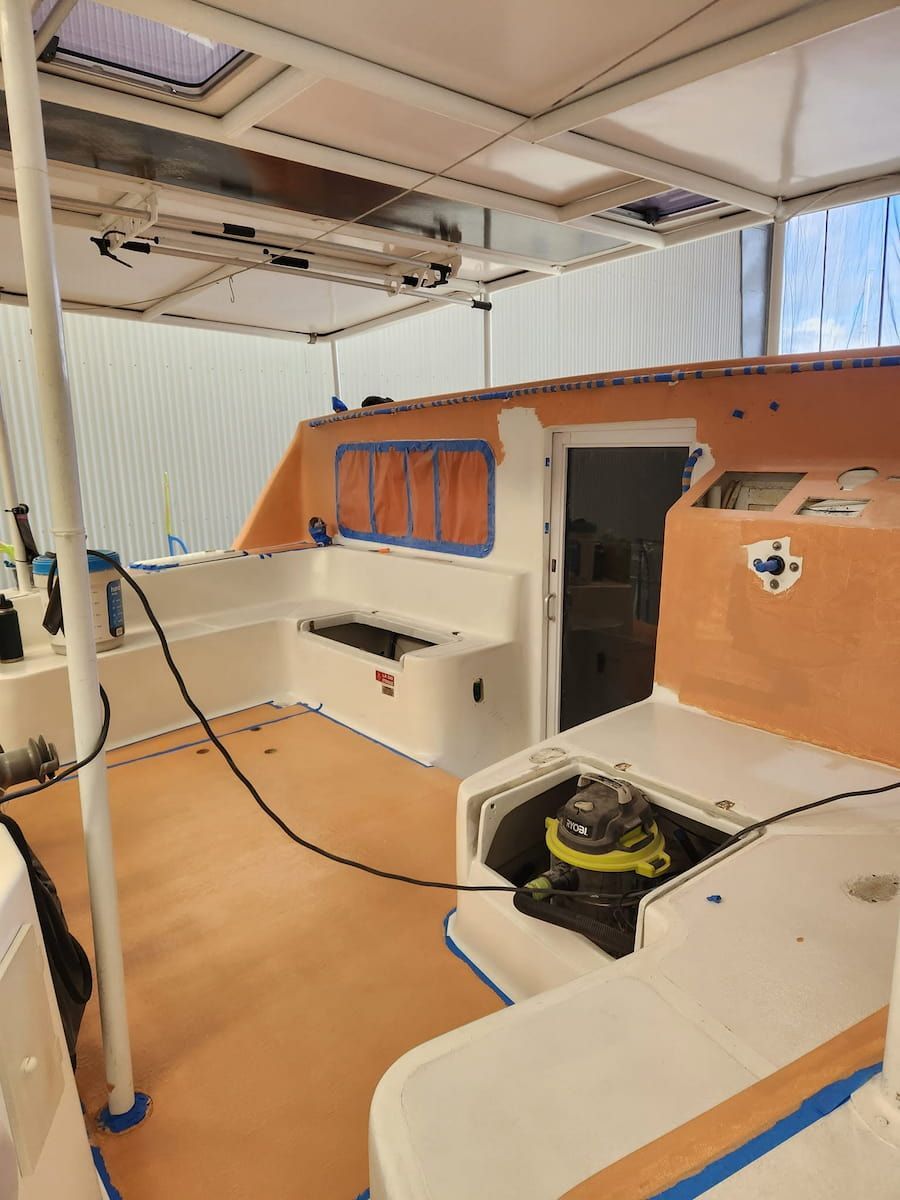 Interior of a Boat Cabin With White and Orange Seating and Windows — Baran Yachting in Buderim, QLD
