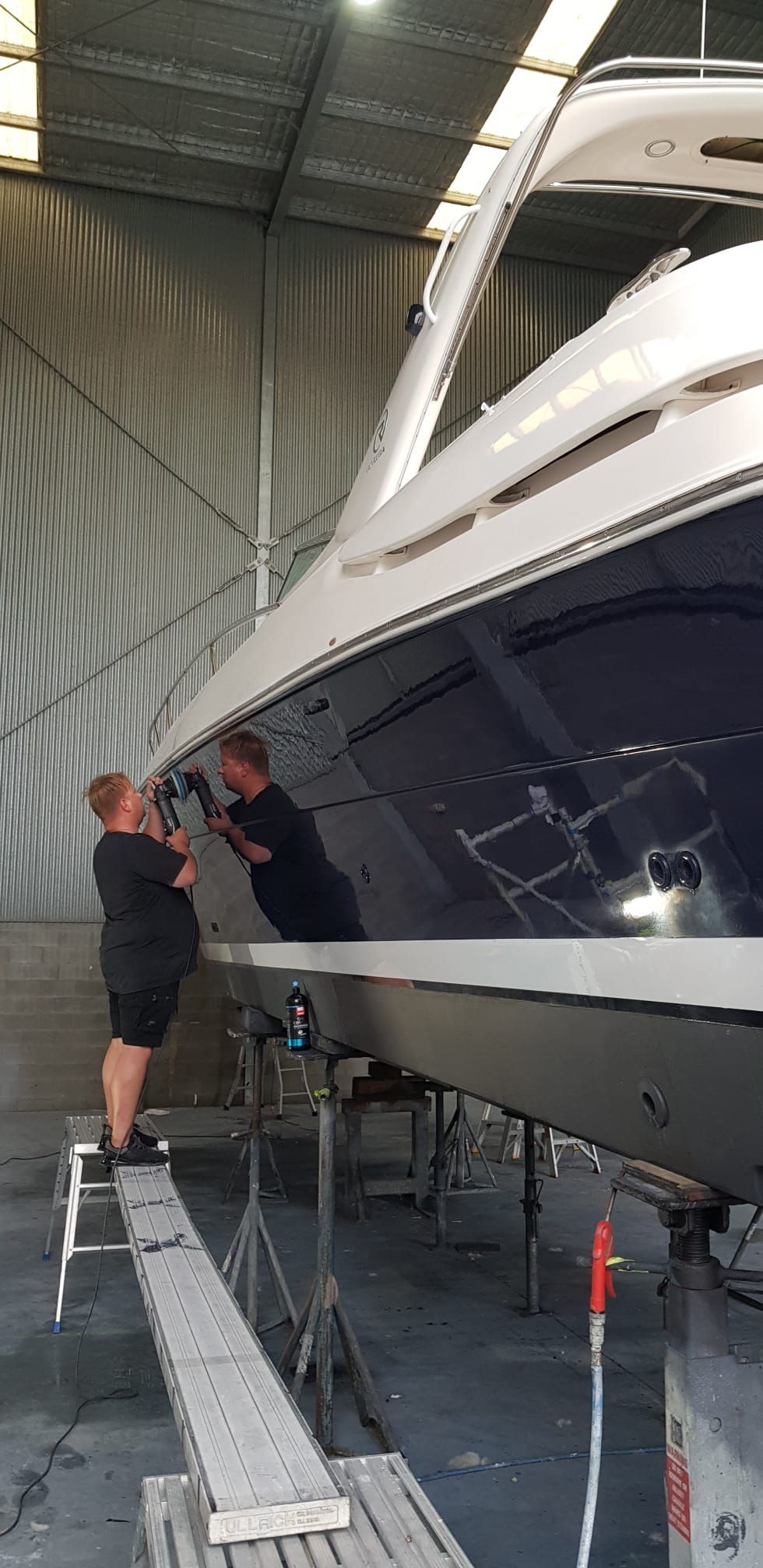 A Man Working on a Boat in a Warehouse — Baran Yachting in Noosa Heads, QLD