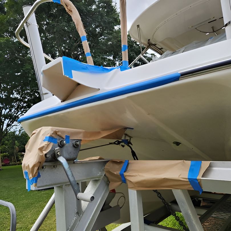 A Boat With Blue Tape on It is Sitting on a Trailer — Baran Yachting in Caloundra, QLD