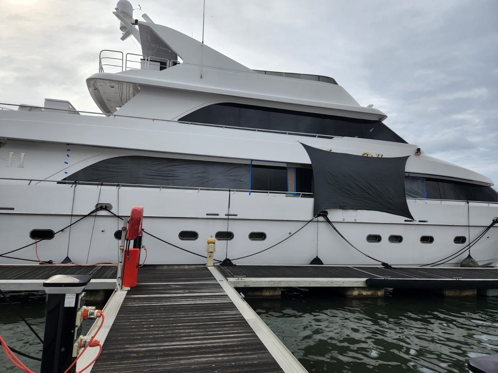 A Large White Yacht is Docked at a Dock — Baran Yachting in Tin Can Bay, QLD