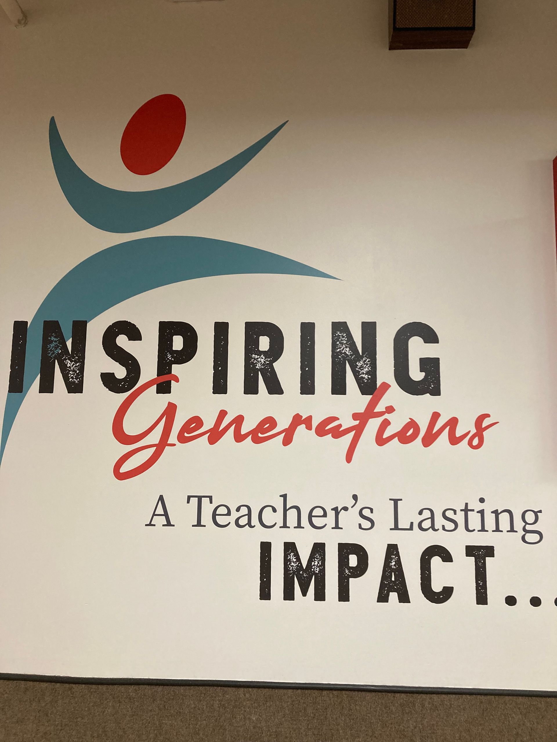 Poster reading “Inspiring Generations, A Teacher’s Lasting Impact” with a stylized blue figure and red dot on white background