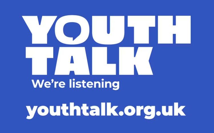 A blue sign that says youth talk we 're listening