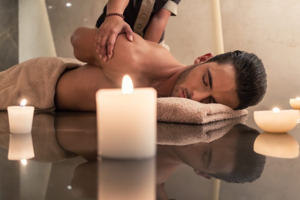 A Man Is Getting A Thai Massage In A Spa — Ocean Bliss Thai Massage In Ballina, NSW