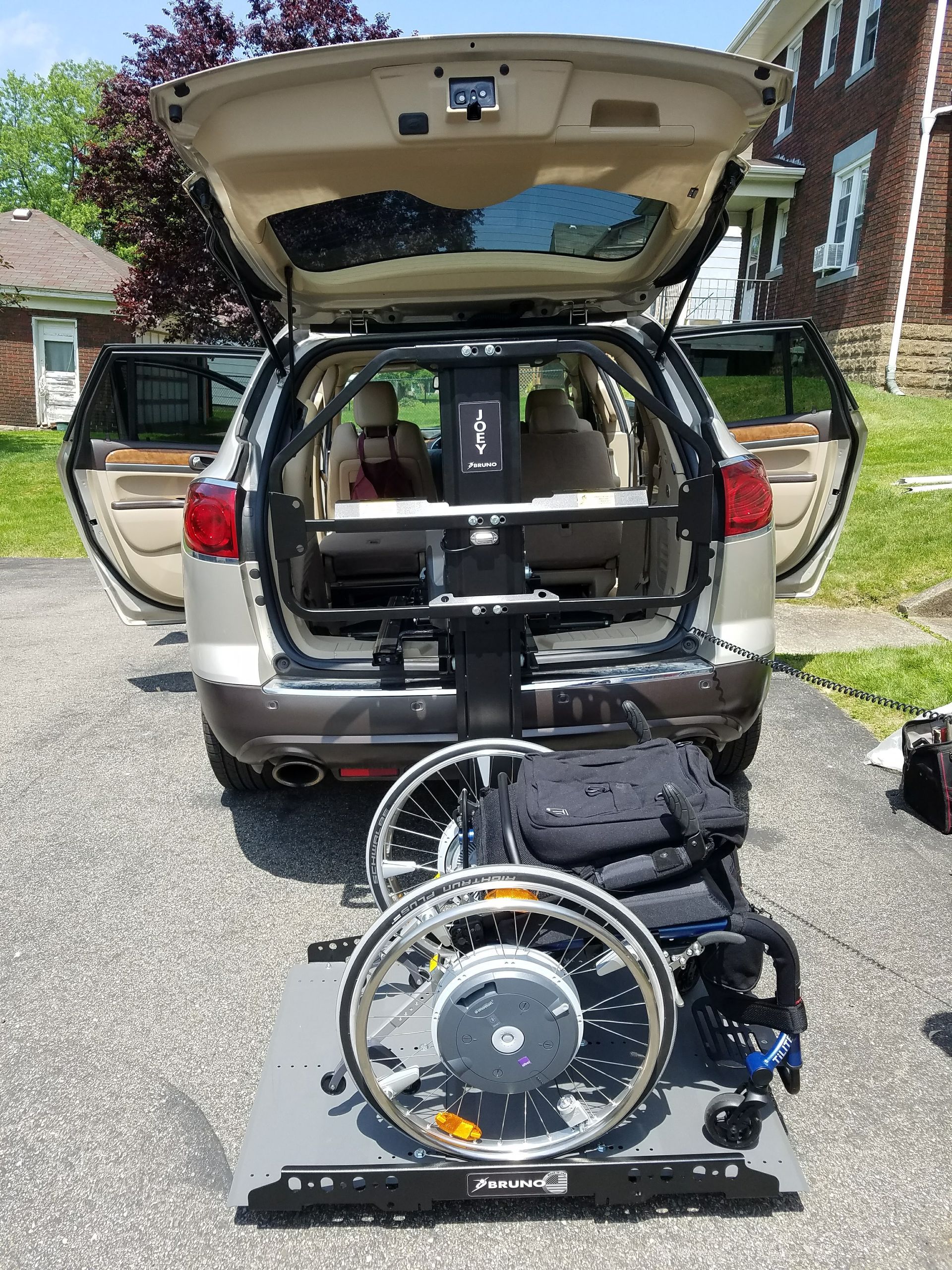 A mobility scooter loaded on a Bruno automobile lift installed by Altamira Ltd. in Lexington, Kentucky