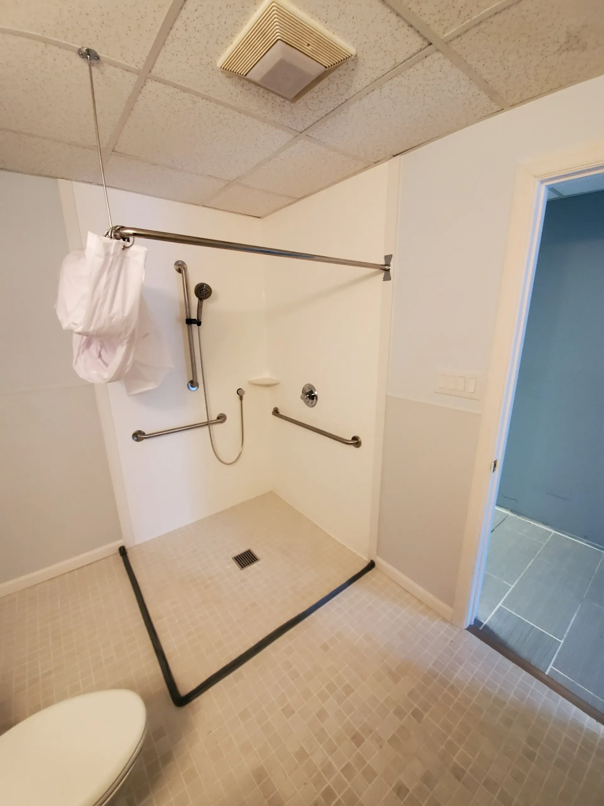 An accessible bathroom modification with a walk-in shower, installed by Altamira Ltd. in Indianapolis