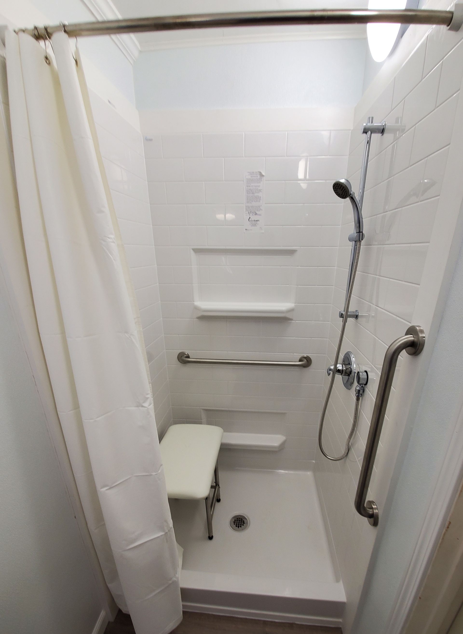 A stair lift Installed by Altamira Ltd. is sitting on a set of stairs.