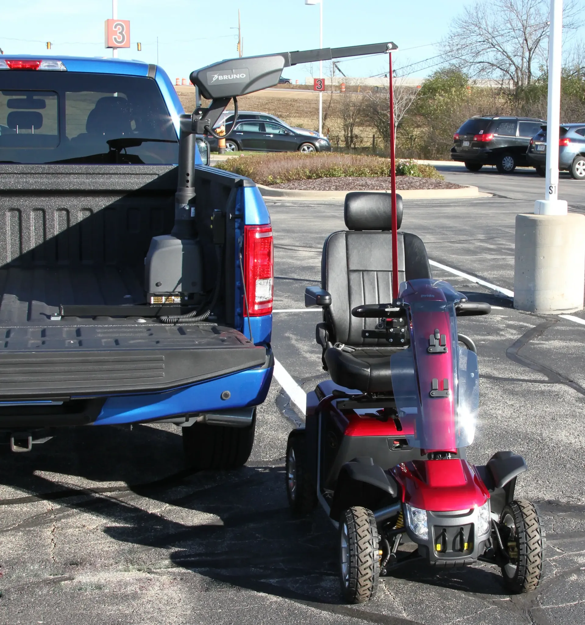 Mobility device being loaded with a vehicle lift