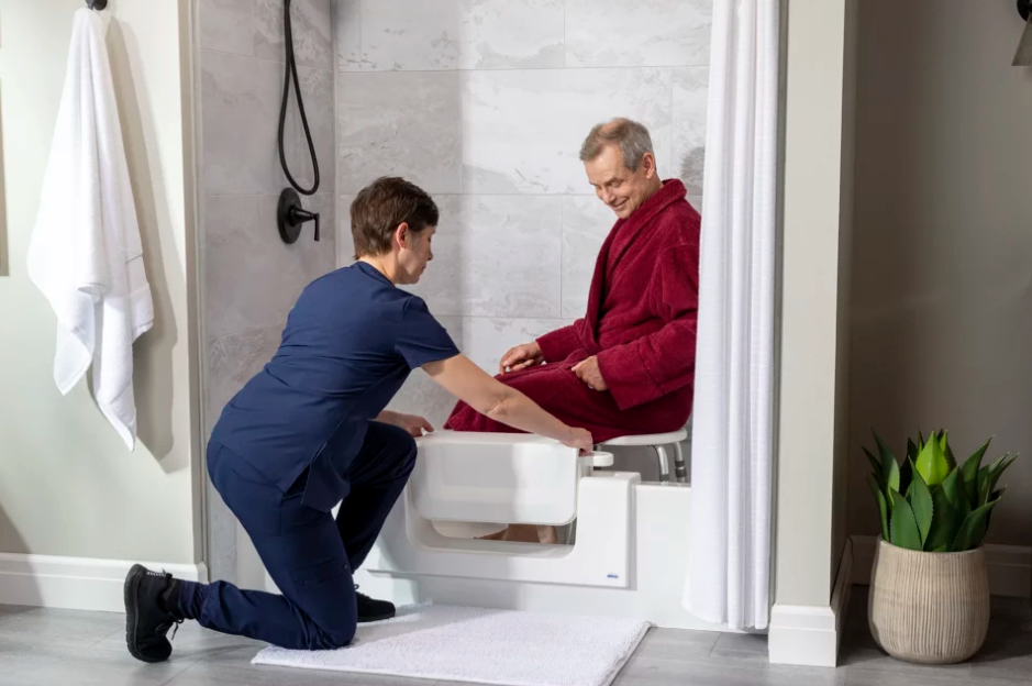 A white accessible bathtub with a door on the side of it from Altamira Ltd.'s Tub Cut Service