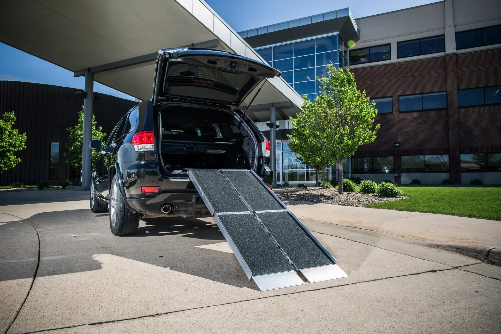 A portable trifold aluminum wheelchair ramp supplied by Altamira Ltd. in Henderson, Kentucky