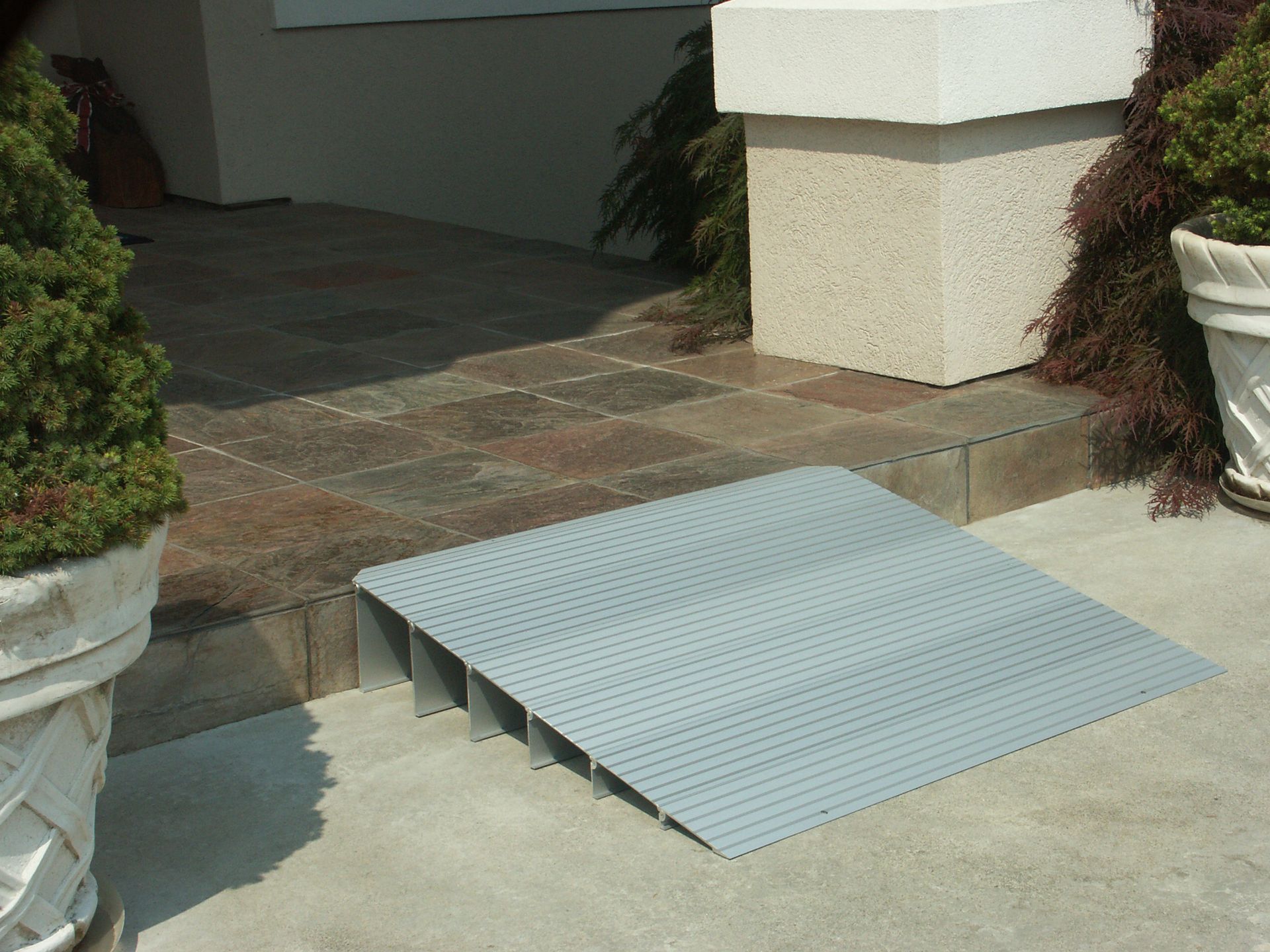 A house with a threshold ramp leading to the front door, installed by Altamira Ltd.