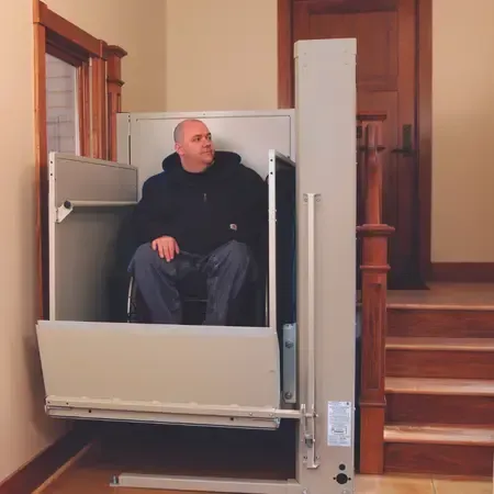 Bruno vertical platform lift installed at a home's front entrance for wheelchair access
