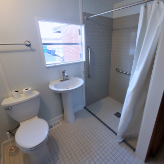 Barrier-free curbless roll-in shower