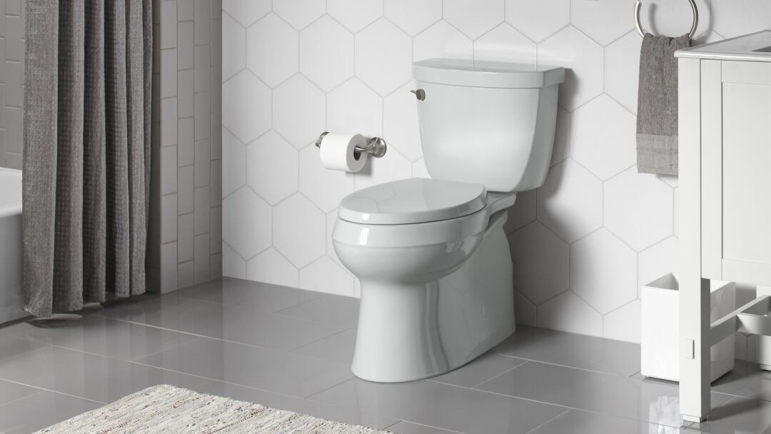 Comfort-height toilet and accessible fixtures by Altamira