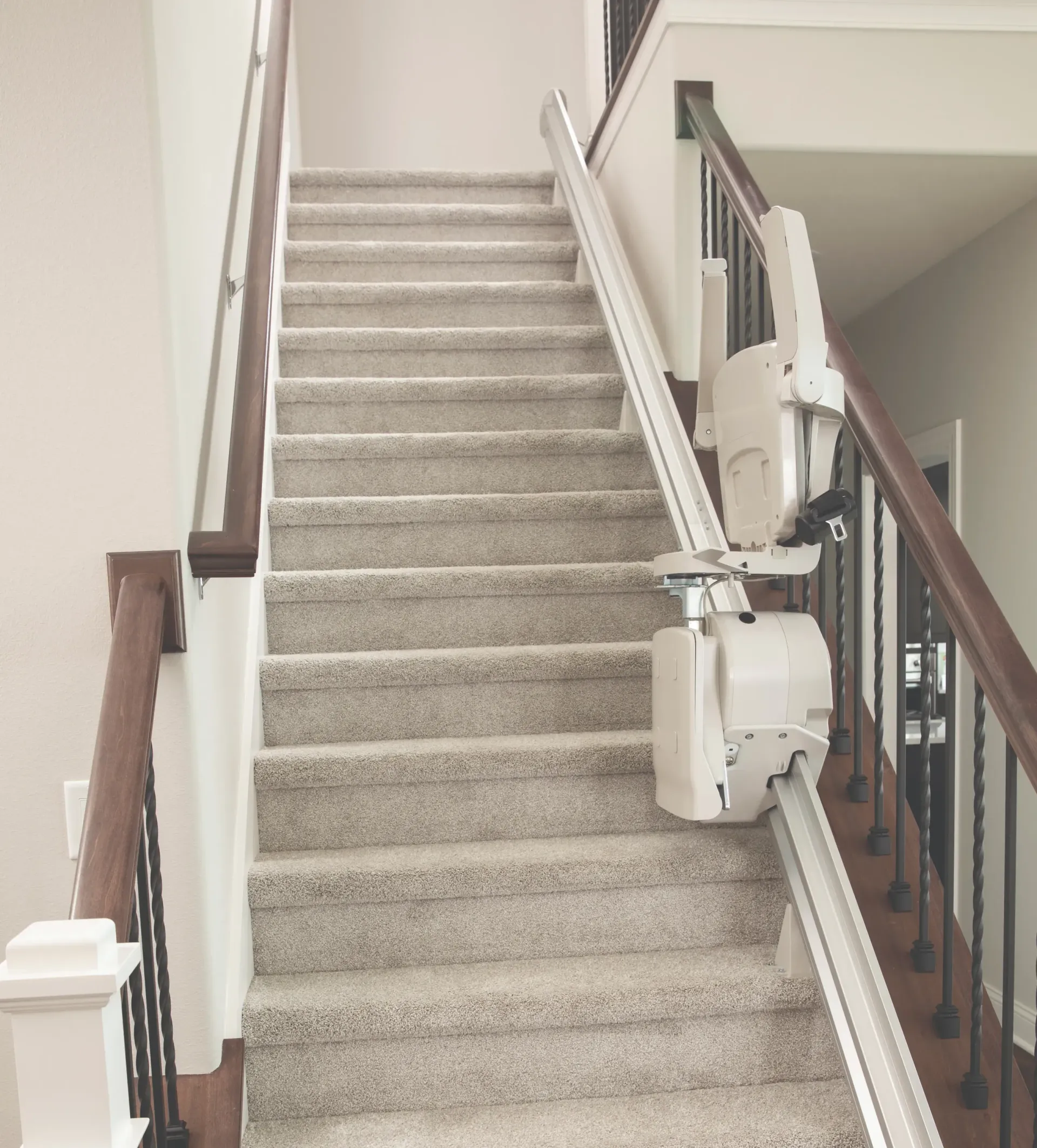 A Bruno indoor straight stairlift installed on a staircase by Altamira Ltd.