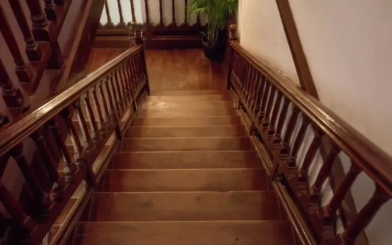 Empty upstairs staircase and landing that has gone unused