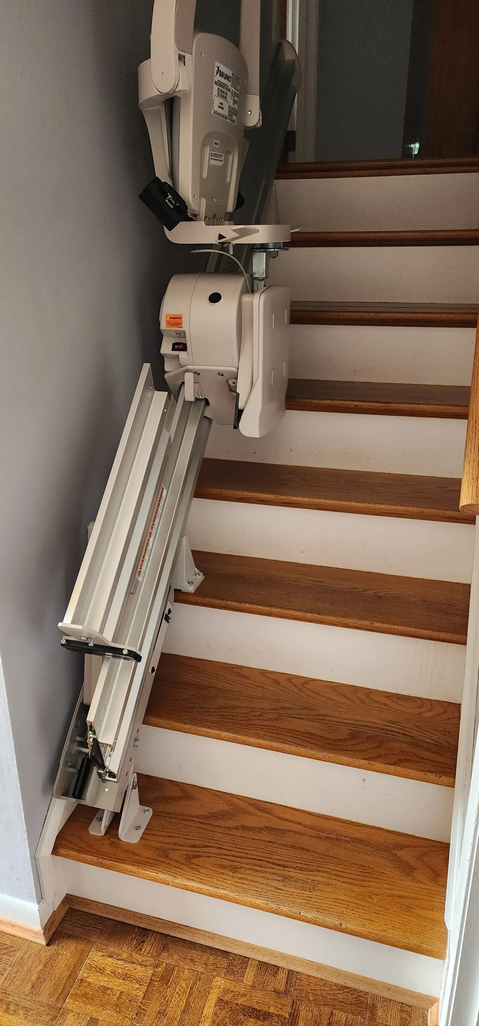 Stairlift power folding rail