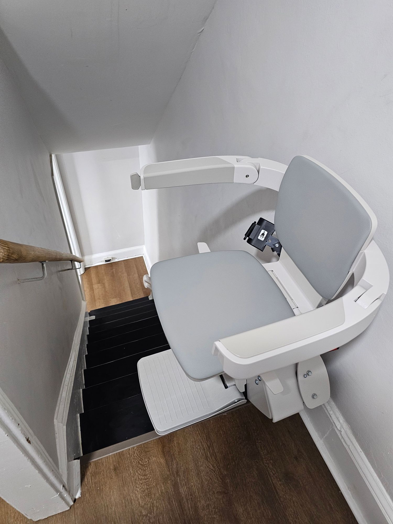 Stairlift installed on a staircase inside a customer's home