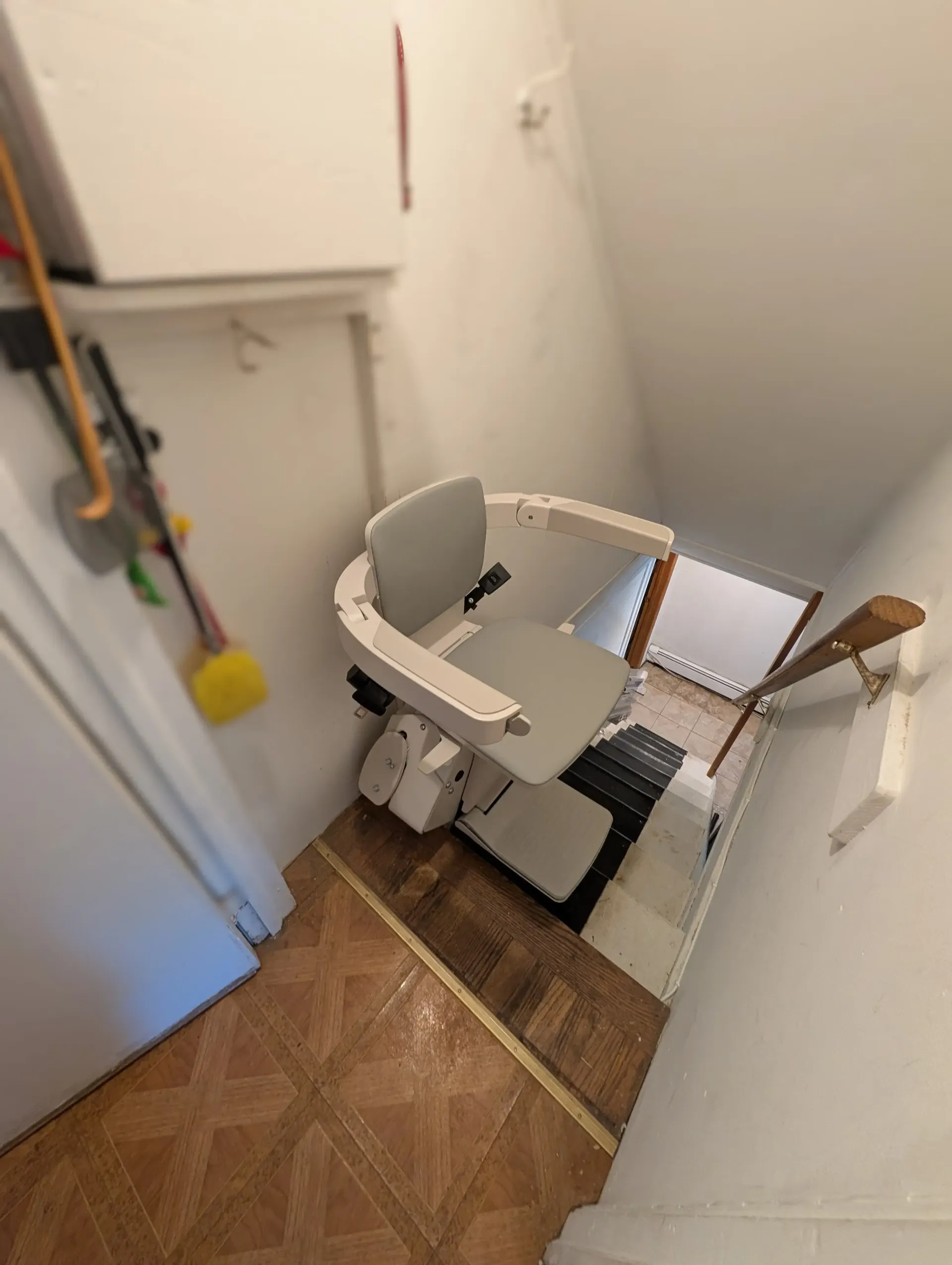 Stairlift installed on a basement staircase