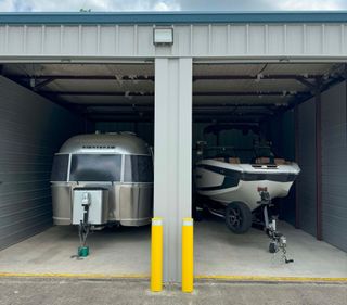 Boat and RV stored in an enclosed unit at Advanced Mini Storage in Zachary, LA