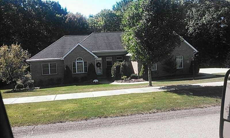 House With Black Roof & Large Windows