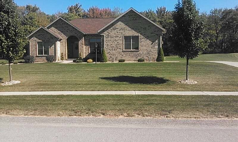 Brick House With Green Lawn