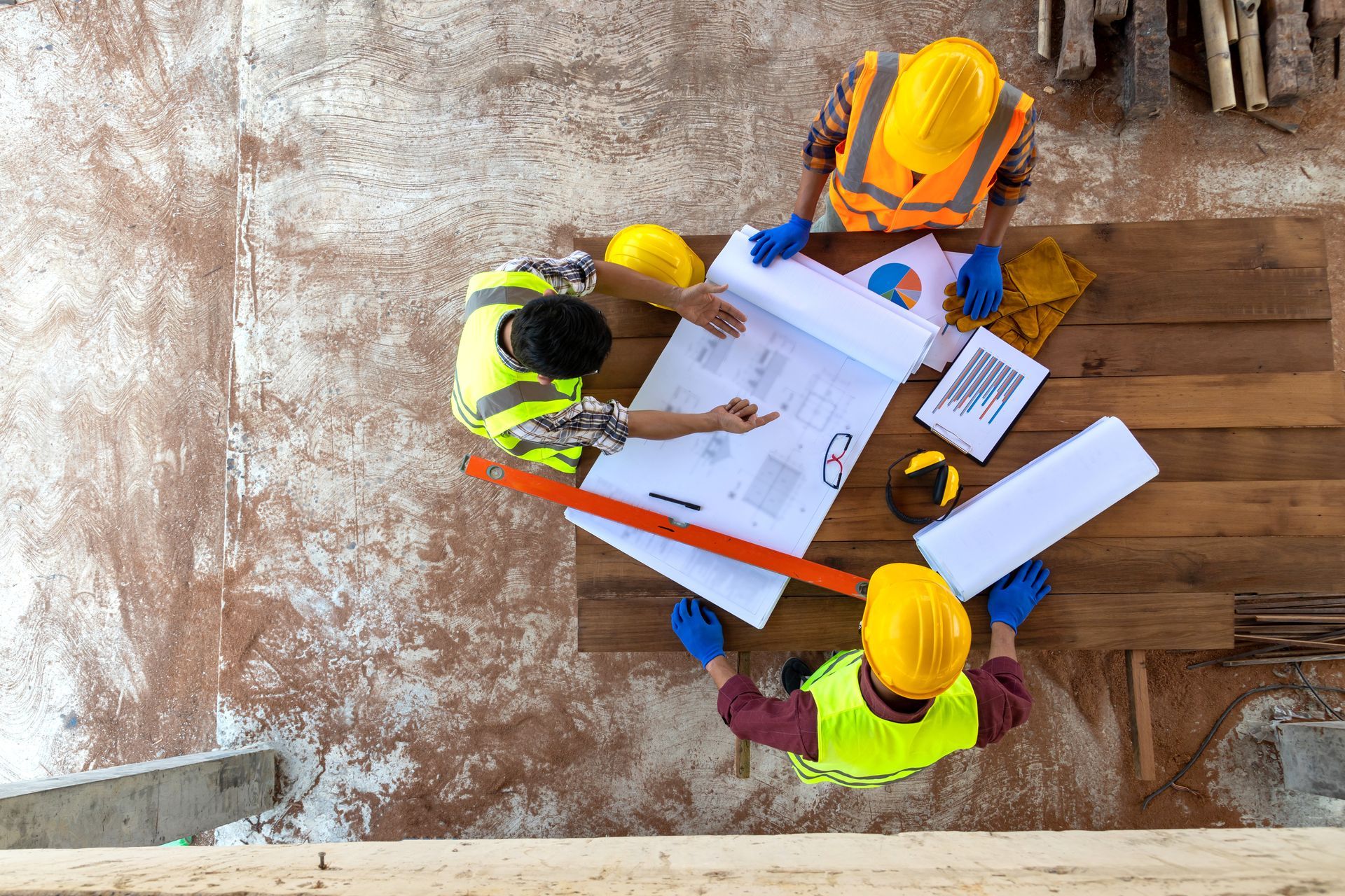 A group of men is working on a house.