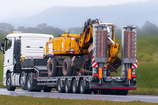 A heavy-duty truck is being towed. A heavy-duty truck is being towed.