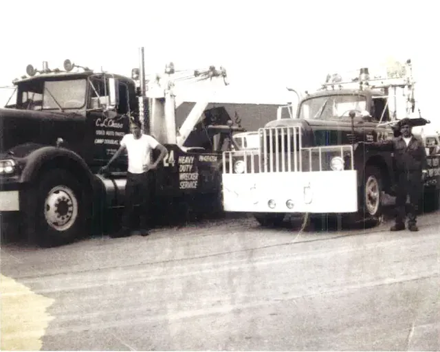 C.L. Chase Towing Trucks On Black And White Image — Camp Douglas, WI — C. L. Chase 24 Hour Towing & Recovery