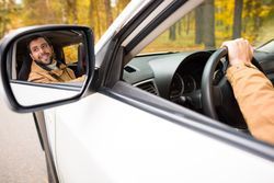 Man Inside The Car Seen On A Side Mirror — Camp Douglas, WI — C. L. Chase 24 Hour Towing & Recovery