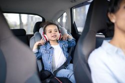 Kid With Headphones While Mom Is Driving — Camp Douglas, WI — C. L. Chase 24 Hour Towing & Recovery Kid With Headphones While Mom Is Driving — Camp Douglas, WI — C. L. Chase 24 Hour Towing & Recovery